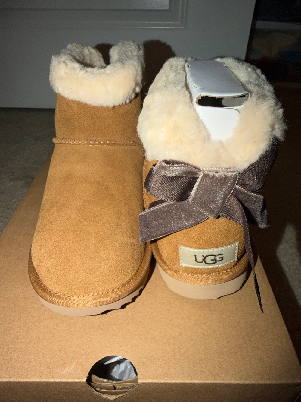 UGG Chestnut Suede Shearling Booties with Velvet Bow Accent